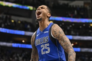 Dallas Mavericks forward P.J. Washington (25) celebrates during the second half against the Portland Trail Blazers at the American Airlines Center.