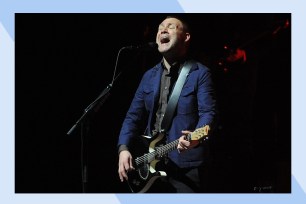 Singer David Gray belts onstage.