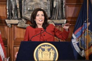 Gov. Kathy Hochul presenting her 2026 executive state budget at a podium in the Red Room at the state Capitol in Albany, N.Y.