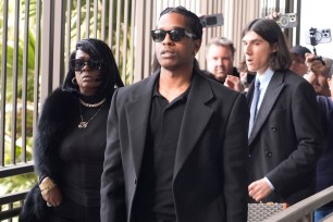 Grammy-nominated rapper A$AP Rocky, center, facing two felony counts of assault with a semiautomatic firearm after allegedly shooting at a former friend in 2021, arrives at the Clara Shortridge Foltz Criminal Justice Center in Los Angeles, Wednesday, Jan. 22, 2025.
