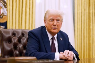 President Donald Trump speaks to reporters after signing a series of executive orders in the Oval Office of the White House on January 23, 2025 in Washington, DC.
