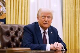 President Donald Trump speaks to reporters after signing a series of executive orders in the Oval Office of the White House on January 23, 2025 in Washington, DC.