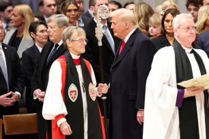 President Donald Trump stands near Reverend Mariann Edgar Budde as he attends the National Day of Prayer Service at the Washington National Cathedral in Washington, U.S., January 21, 2025.
