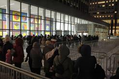 Migrant families stand in line at 26 Federal Plaza in Manhattan with documents in hand to see if they can stay in the United States.