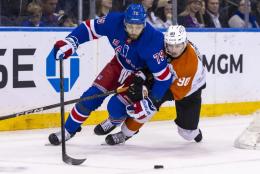 K'Andre Miller skates ahead of Anthony Richard as he moved the puck up ice during the Rangers' 6-1 blowout win over the Flyers.